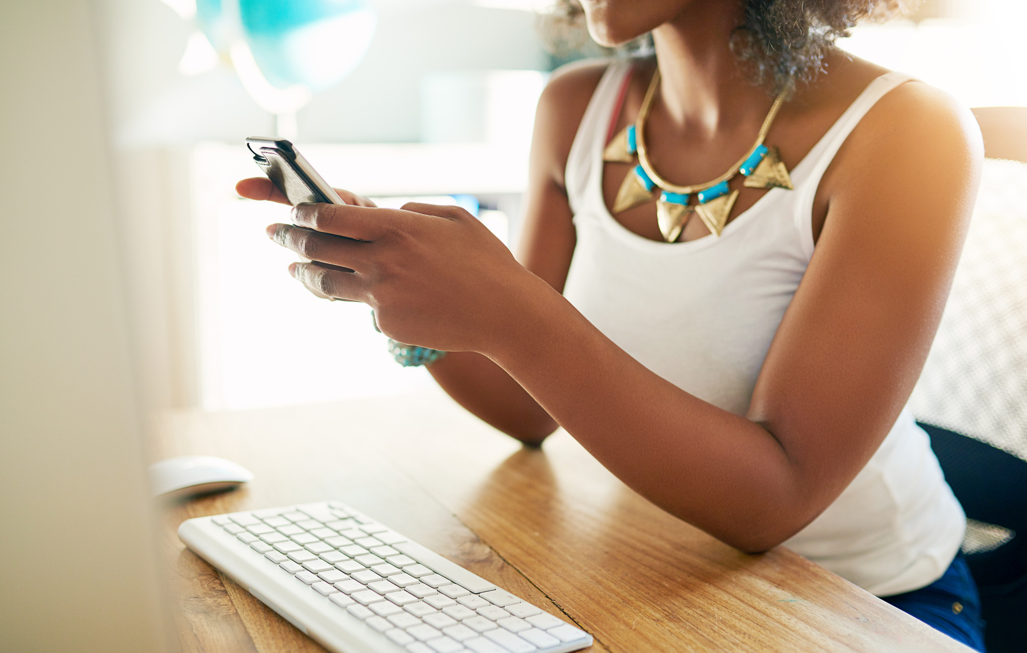 Young Businesswoman Reading a Text Message